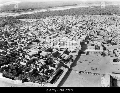 Baghdad, Iraq:  1932 An aerial view of the Kadhimain mosque in Baghdad showing its striking landmark of golden domes and minarets. Stock Photo