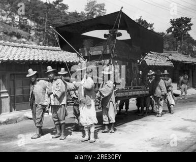 Seoul, South Korea:  June 28, 1947 A native Korean funeral procession which derives from a mixture of the religions of Buddhism and Confucianism. The period of mourning typically lasts three years. Stock Photo