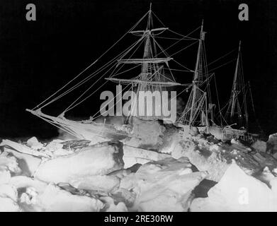 Antarctica:  August 27, 1915 Shackleton's ship, the Endurance, as it lay locked in the Weddell Sea in Antaractica, where it finally sank. The remarkable lighting was furnished by an oil fire at the bow and a great deal of flash (gun) powder. Stock Photo