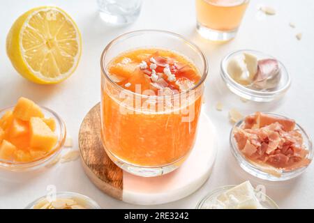 Preparation of melon gazpacho and surrounding ingredients Stock Photo