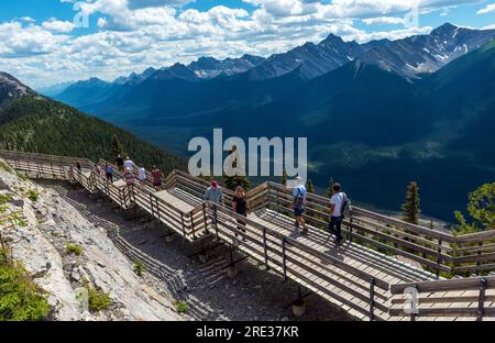 Tourists walking the Sulphur Mountain hike on elevated walkway after taking the Banff Gondola cable car, Banff national park, Canada. Stock Photo