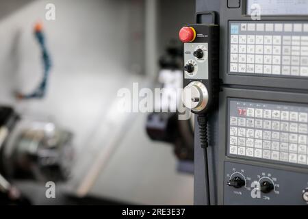 Manual operation unit of CNC lathe machine. Selective focus. Stock Photo