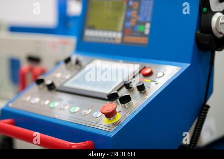 Switches and buttons on the control panel of industrial CNC machine. Selective focus. Stock Photo