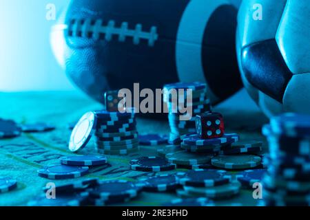 Image of several red dice falling on green table on background of multicolored spots Stock Photo