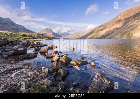 The vastness of Wastwater nestled in the Wasdale valley with scafell pike rising in the background, lake district Cumbria north east England Stock Photo