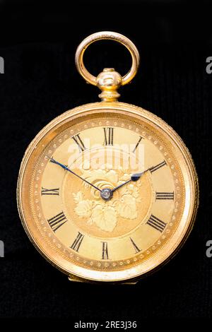 Vintage Swiss clockwork mechanism. Gold pocket watch on stone background. Gold Silver Precision Antique Vintage Pocket Watch Bodies Parts Stock Photo