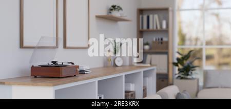 Close-up rear view image of a vintage vinyl record player is on a minimal wooden cabinet in a minimal bright living room. 3d render, 3d illustration Stock Photo