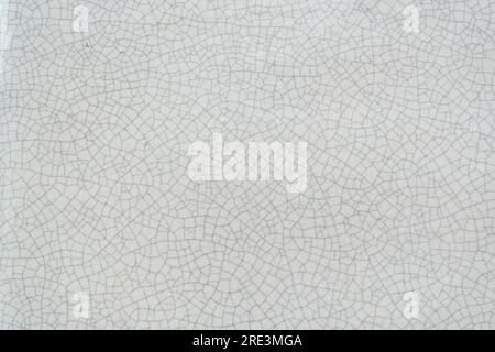 Cracked white ceramic texture background Stock Photo