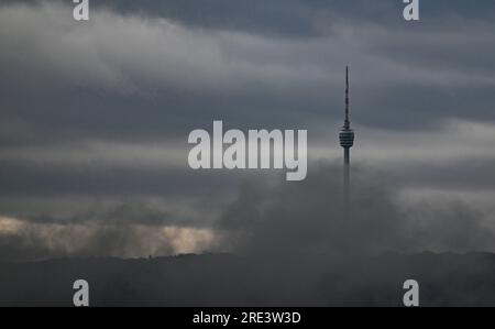 Stuttgart, Germany. 25th July, 2023. Dark rain clouds pass over the Stuttgart TV tower. According to the forecast, the weather will remain rainy and stormy in the coming days. Credit: Bernd Weißbrod/dpa/Alamy Live News Stock Photo