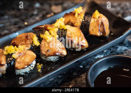 Sushi, Foie Gras Sushi with Yuzu orange skin and shoyu sauce Stock Photo