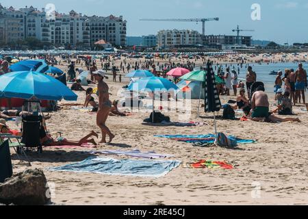 Sao Martinho do Porto, Portugal - July 23, 2023: Crowded beach at Sao Martinho do Porto, Portugal on a summer day Stock Photo