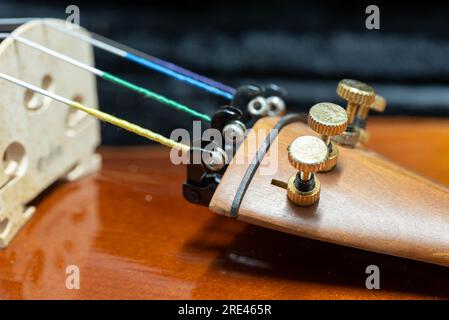 Close up of wooden violin on a dark background Stock Photo
