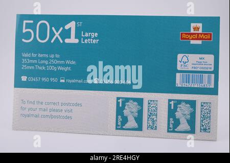 England, 25th July 2023: Fake Royal Mail 1st Class Large Letter Stamps - Counterfeit Royal Mail barcoded stamps are for sale on eBay at a fraction of the genuine price. Sheets of 50 stamps are for sale as low as 15 pounds (GBP) and to the unsuspecting eye look real. However under UV light, small differences can be seen. Credit: Stop Press Media/Alamy Live News Stock Photo