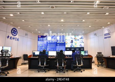 (230725) -- PINGTANG, July 25, 2023 (Xinhua) -- Staff members work at the control room of China's Five-hundred-meter Aperture Spherical Radio Telescope (FAST) in Pingtang County, southwest China's Guizhou Province, July 25, 2023. FAST, the world's largest single-dish radio telescope, has identified over 800 new pulsars since its launch in 2016, its operator said Tuesday.  In recent years, FAST has achieved notable success in the study of fast radio bursts, neutral hydrogen, and pulsars, greatly expanding the scope of the human exploration of the universe.   Dubbed the 'China Sky Eye,' the tele Stock Photo