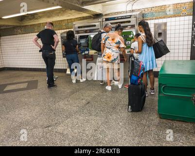 Customers at the MetroCard vending machines in the subway in New York on Sunday, July 23, 2023. (© Richard B. Levine) Stock Photo