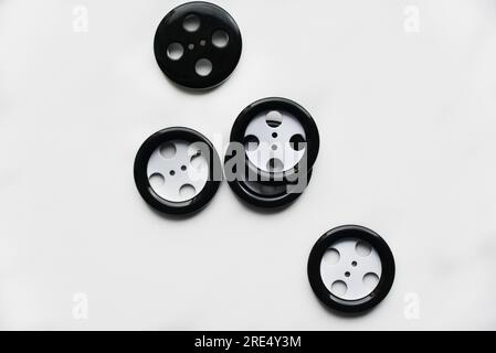Large black and white buttons with clothes on a white background.  Vintage design style. Stock Photo