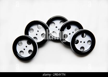 Large black and white buttons with clothes on a white background.  Vintage design style. Stock Photo