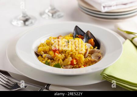 seafood paella in plate on elegant background Stock Photo