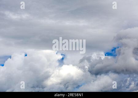 Cloud scape with spots of blue sky Stock Photo