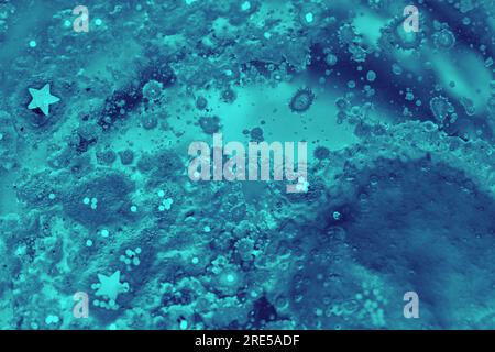 abstract background with golden glitter and liquid crystal effect. Blu liquid crystal with marble effect Stock Photo