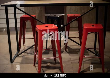Chairs in restaurant. Bar seating. Red chairs. Interior details. Stock Photo