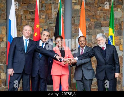 (230725) -- JOHANNESBURG, July 25, 2023 (Xinhua) -- Wang Yi (2nd L), a member of the Political Bureau of the Communist Party of China (CPC) Central Committee and director of the Office of the CPC Central Commission for Foreign Affairs, poses for a group photo with Khumbudzo Ntshavheni (C), minister in the Presidency of South Africa, Celso Luiz Nunes Amorim (1st R), chief adviser of the Presidency of Brazil, Nikolai Patrushev (1st L), secretary of the Security Council of Russia, and National Security Adviser of India Ajit Doval (2nd R) at the 13th Meeting of BRICS National Security Advisers and Stock Photo