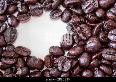 coffee beans on a white background and a white circle on the left side for copy space Stock Photo