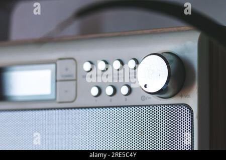 Volume knob in vintage radio. Technology communication background Stock Photo