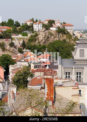 Hillside houses beside Theatre of Philippopolis in Plovdiv, Bulgaria. Only part of the theatre can be seen top left. Rooftops in foreground. July 25, . Stock Photo