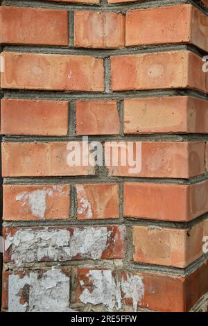 Red brick and brick edge from pillar in front of wall as texture background Stock Photo