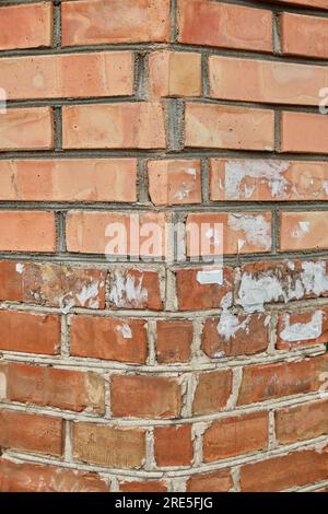 Red brick and brick edge from pillar in front of wall as texture background Stock Photo