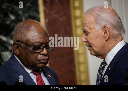 United States President Joe Biden speaks with US House Assistant Democratic Leader James Clyburn (Democrat of South Carolina) after signing a proclamation to establish the Emmett Till and Mamie Till-Mobley National Monument during an event in the Indian Treaty Room of the Eisenhower Executive Office Building next to the White House on July 25, 2023 in Washington, DC Emmett Till was a 14 year old African American boy who was abducted, tortured, and lynched in 1955 by a white mob after being accused of offending Carolyn Bryant, a white woman, in Mississippi. (Photo by Samuel Corum/Sipa USA)Cre Stock Photo