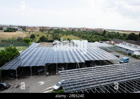 Aerial view of solar panels installed on the roof of car parking. Stock Photo