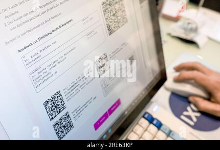 Berlin, Germany. 24th July, 2023. A screen in a pharmacy displays information about e-prescriptions. Credit: Jens Kalaene/dpa/Alamy Live News Stock Photo