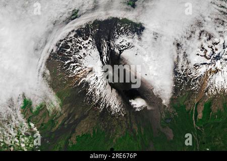 Unmake Island, United States. 17 July, 2023. View from Earth Orbit of the Shishaldin volcano in the Aleutian Islands as it erupts July 17, 2023 in Unmake Island, Alaska. Mount Shishaldin is a cone-shaped stratovolcanoand is one of the most active volcanoes in the Aleutian arc.  Credit: Wanmei Liang/NASA/Alamy Live News Stock Photo