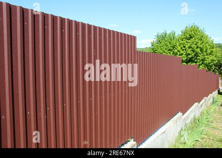 The fence, which is mounted from a metal profile Stock Photo