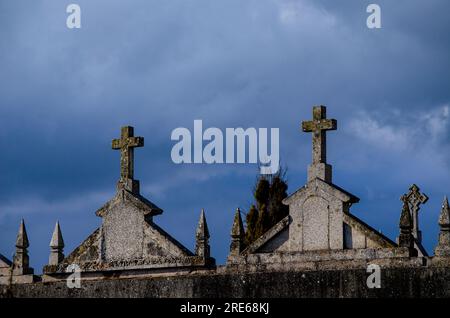 tombs with crosses on top in a catholic cemetery Stock Photo