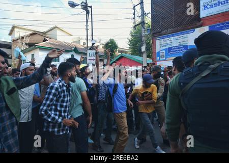 Srinagar, India. 25th July, 2023. Policemen detains members of the nomadic Gujjar and Bakarwal during a protest in Srinagar, Indian controlled Kashmir, Tuesday, July 25, 2023. Police in Indian portion of Kashmir detained dozens of Gujjars and Bakarwals, who were protesting against the inclusion of upper castes in the Scheduled Tribe list, in Jammu and Kashmir. (Photo by Mubashir Hassan/Pacific Press) Credit: Pacific Press Media Production Corp./Alamy Live News Stock Photo