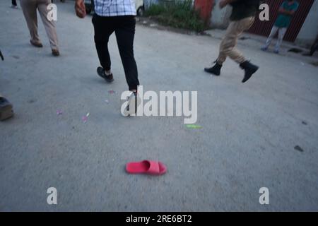 July 25, 2023, Srinagar, Jammu and Kashmir, India: Policemen chases members of the nomadic Gujjar and Bakarwal during a protest in Srinagar, Indian controlled Kashmir, Tuesday, July 25, 2023. Police in Indian portion of Kashmir detained dozens of Gujjars and Bakarwals, who were protesting against the inclusion of upper castes in the Scheduled Tribe list, in Jammu and Kashmir. (Credit Image: © Mubashir Hassan/Pacific Press via ZUMA Press Wire) EDITORIAL USAGE ONLY! Not for Commercial USAGE! Stock Photo