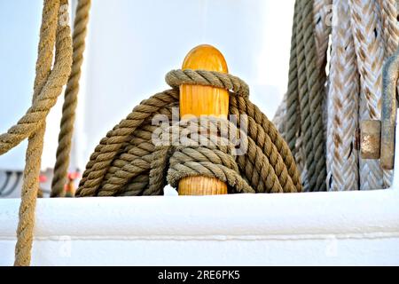 Hempen lines neatly coiled on a beautiful vintage classic sailing ship. Stock Photo