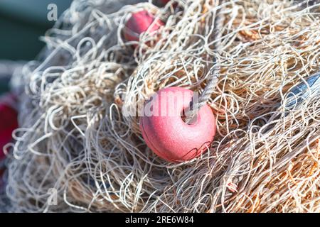 Fishing nets and floats on a fishing boat Stock Photo