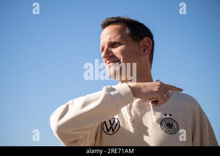 Wyong, Australia. 26th July, 2023. Soccer, Women: World Cup, Germany, press conference: Panagiotis 'Joti' Chatzialexiou, sporting director national teams, stands in front of blue sky after the press conference. Credit: Sebastian Christoph Gollnow/dpa/Alamy Live News Stock Photo