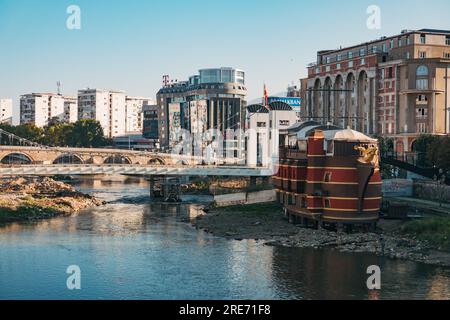 a much-ridiculed fake galleon ship mounted on the banks of the Vardar River in Skopje, North Macedonia as part of a 2014 project Stock Photo