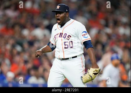 Texas Rangers right fielder Adolis Garcia (53) and left fielder Ezequiel  Duran (20) celebrate after closing the tenth inning of a baseball game  against the New York Yankees, Friday, June 23, 2023