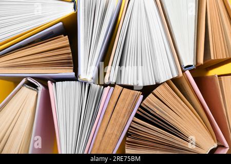 Many half open books as background Stock Photo