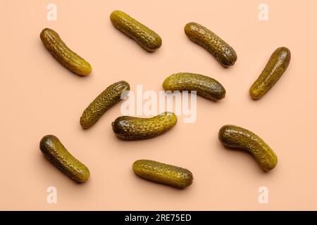 Pickled cucumbers on orange background Stock Photo