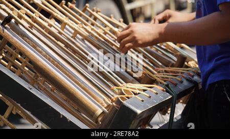 Songklang Instrument Angklung is a traditional instrument from Indonesia, isolated on white ...