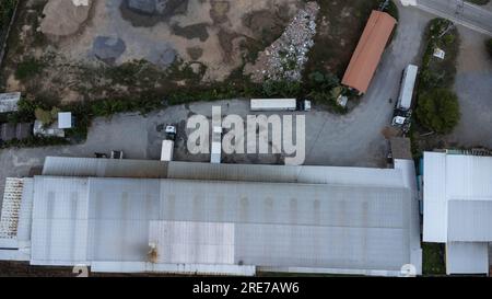 Aerial view of parked trailer truck loading parcel boxes at warehouse. Industry Freight Truck Transportation. Shipping Warehousing Logistics. Stock Photo