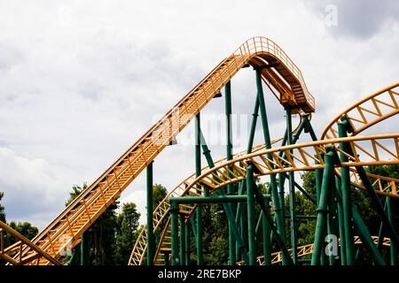 close-up image of a rollercoaster track and the cloudy sky Stock Photo