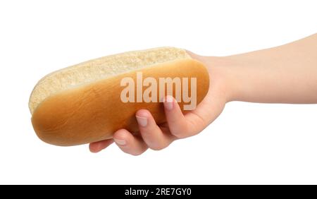 Woman holding tasty hot dog bun on white background, closeup Stock Photo